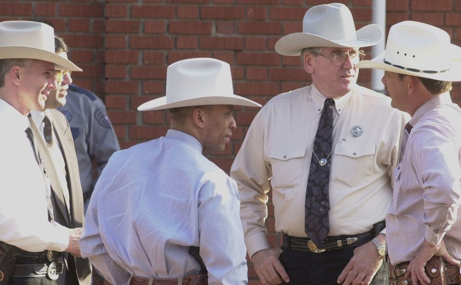 Texas Rangers are standing outside the police station.