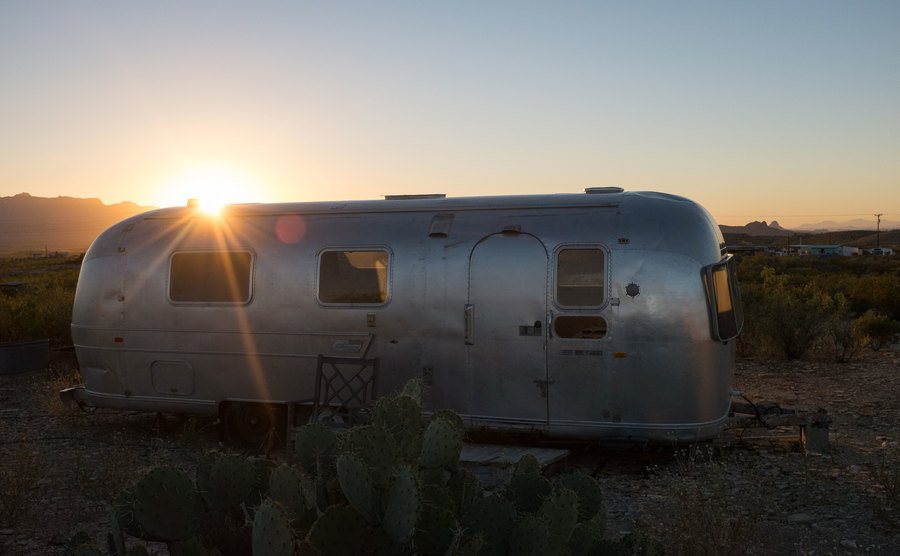 A view of a trailer house during sunrise.