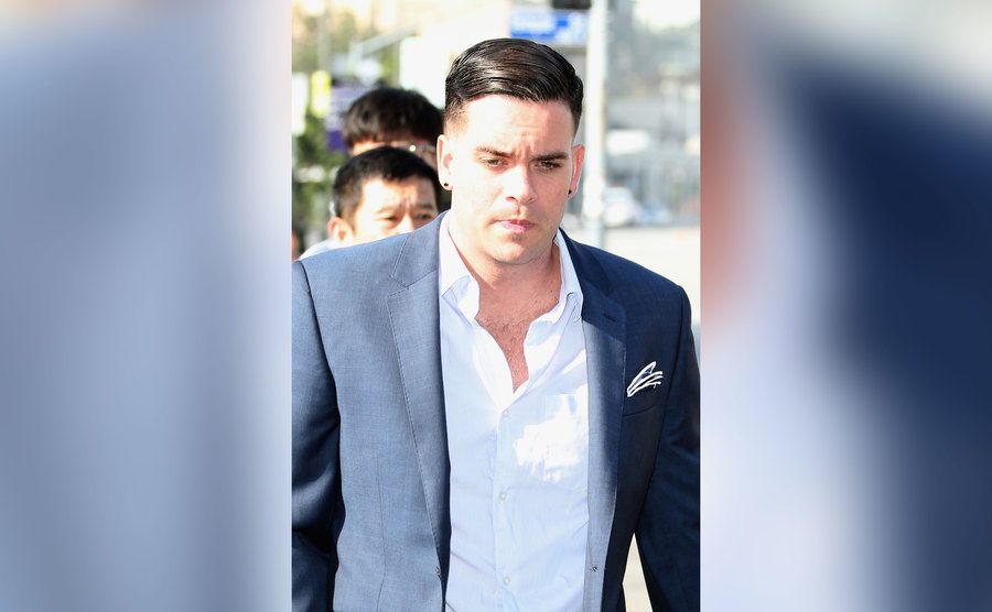 Mark Salling in a suit arriving for a court appearance in 2016.