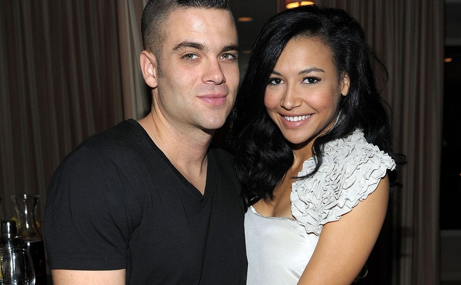 Mark Salling and Naya Rivera in a close embrace at the celebration of Glee's Golden Globe nominations.