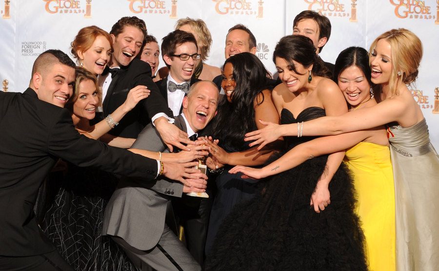 Ryan Murphy poses with the cast of