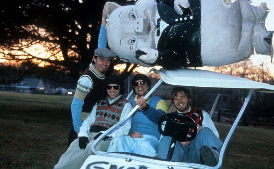 Brandon Dicamillo, Johnny Knoxville and Ryan Dunn ride a golf cart on set of the film Jackass: The Movie.