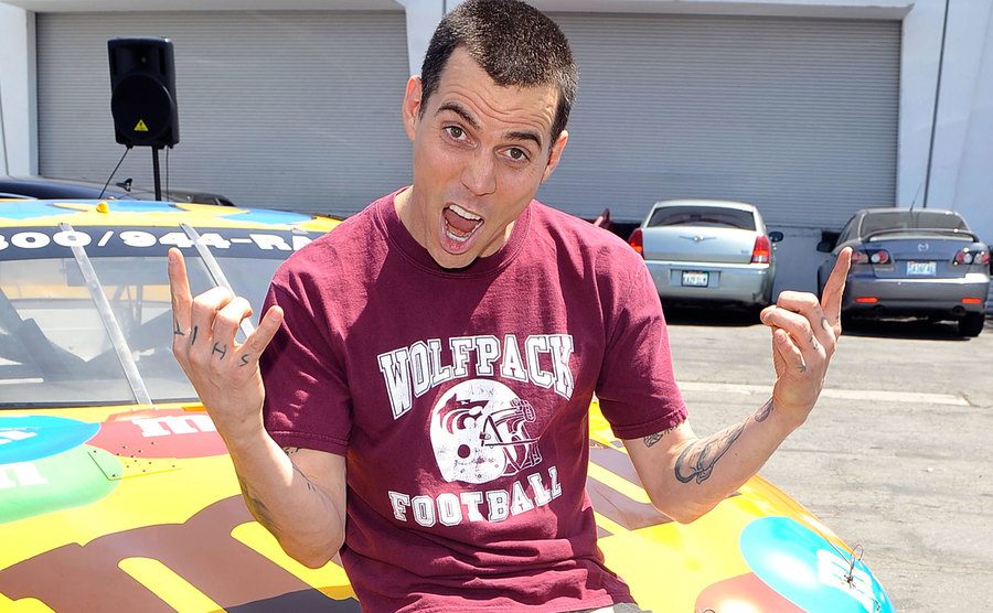 Steve O giving a rock on sign with his fingers at the Celebrity Go-Kart Tournament. 