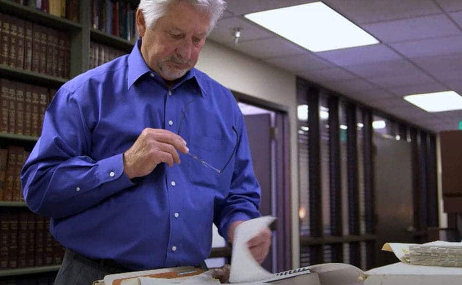 Ken Wagner is going through Stella’s file case.