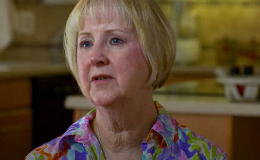 Judy Allen talks during a televised interview.