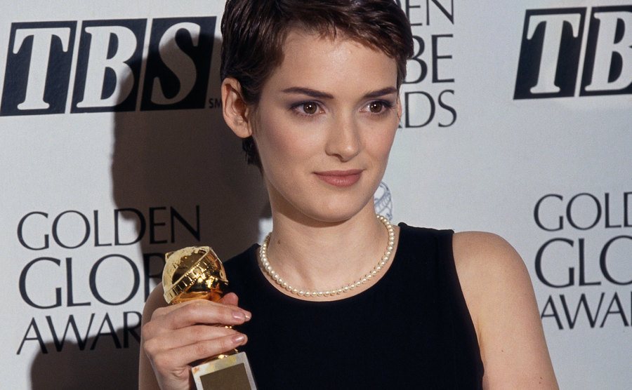 Winona Ryder holds her Golden Globe Award.