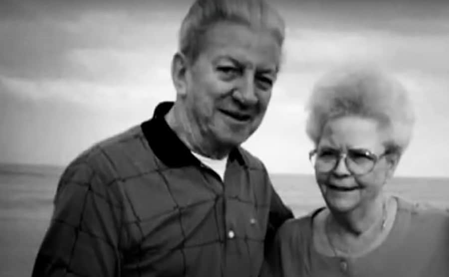 John and Betty take a picture on the beach.