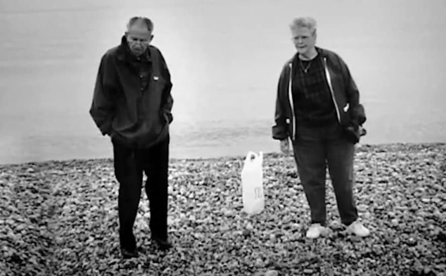 John and Betty walk by the beach.