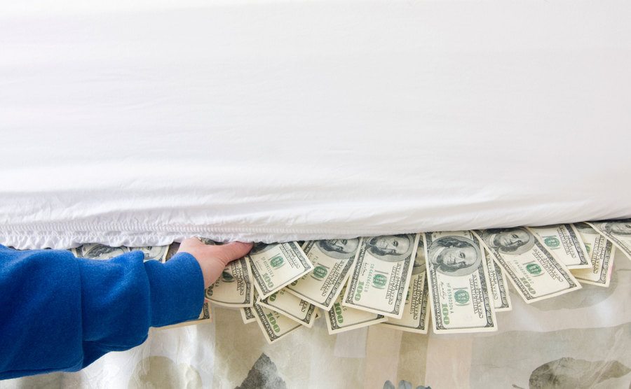 Cash is found under a bed.