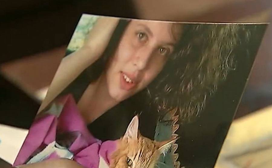 Shauna Burns holds a picture of Hailey in her hands.