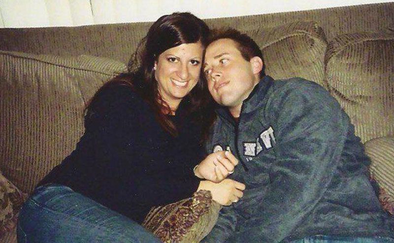 Travis and Dianna are lying comfortably on the couch.