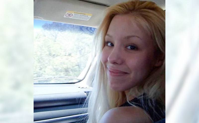 A picture of Jodi inside the car.