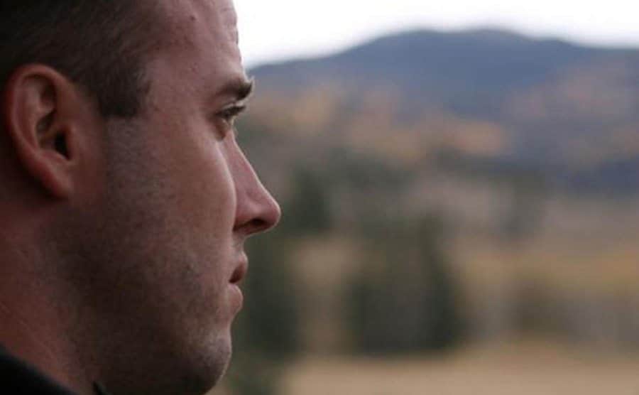 Travis contemplates the surrounding landscape.