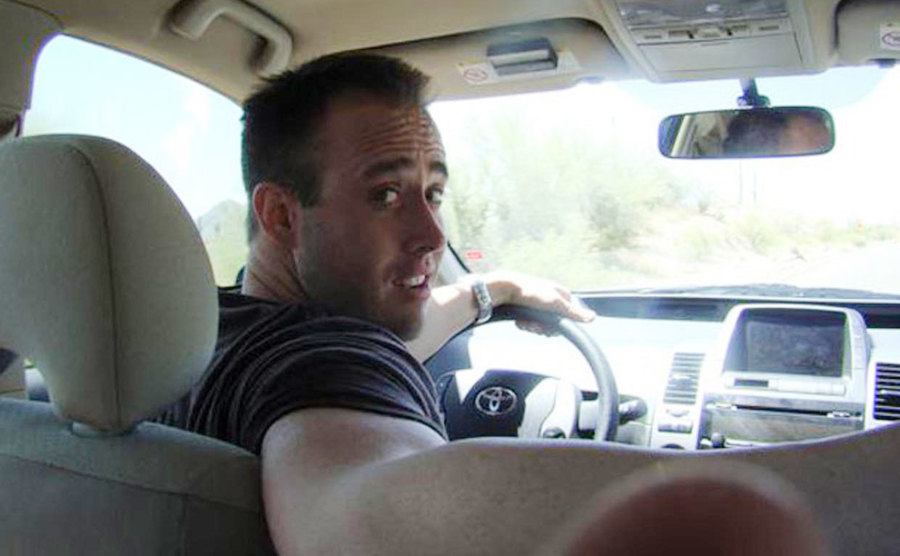Travis is driving his car.