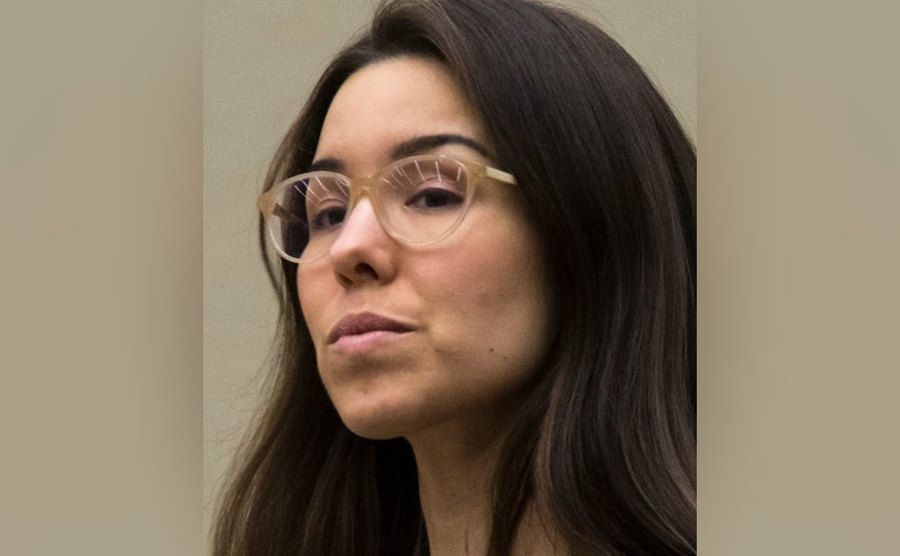 Jodi Arias is standing in court.