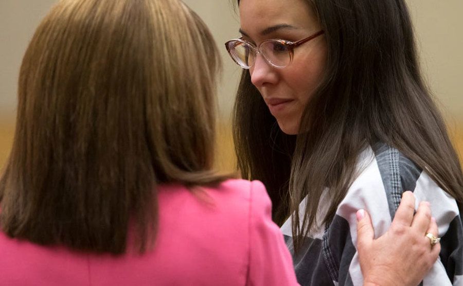 Jodi Arias stands in court.