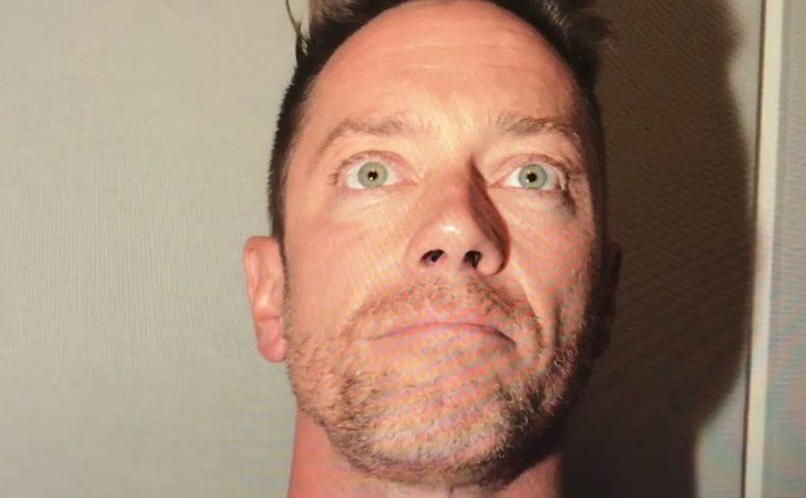 A close-up on David’s expression during interrogation.