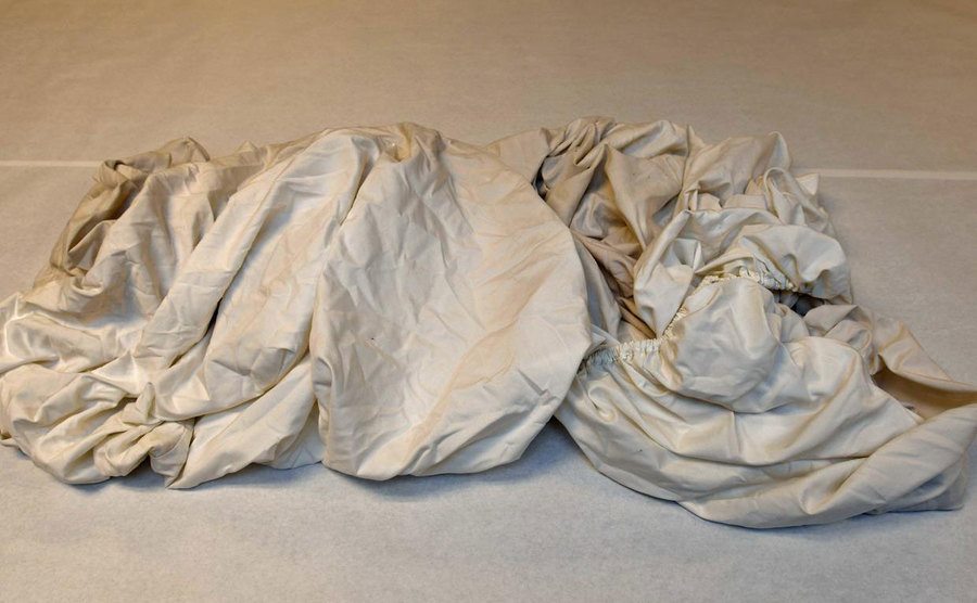 A photo of a set of dirty bedsheets.