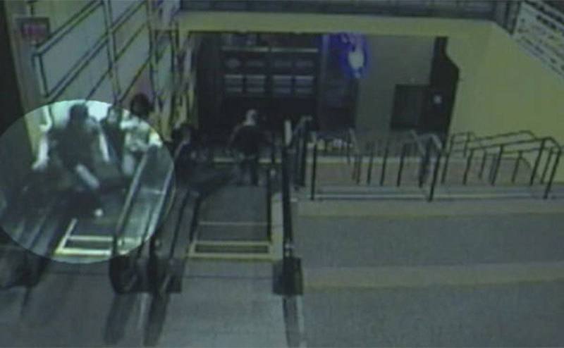 CCTV footage of Brain on the escalator.