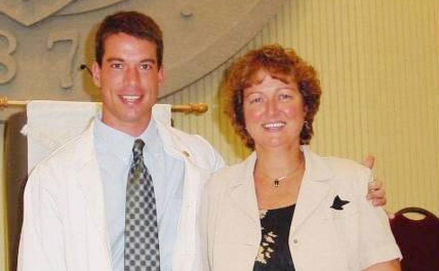 Brian poses for a photo with his mother.