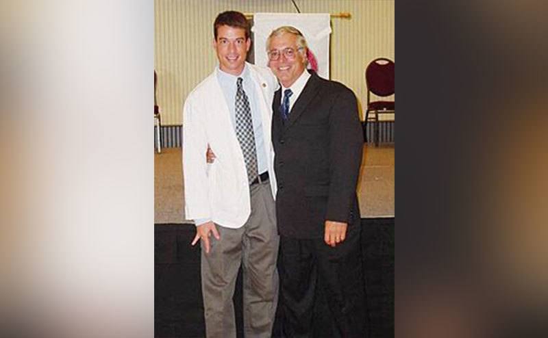 Brian poses with his father.