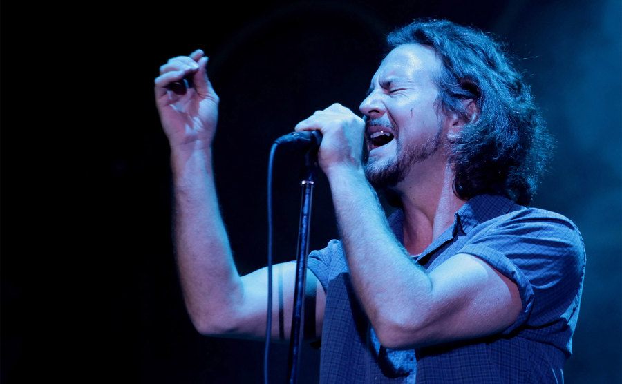 Eddie Vedder of Pearl Jam performs on stage.