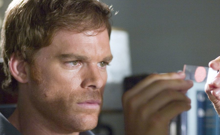 A still of Michael C. Hall as Dexter holding a blood sample.