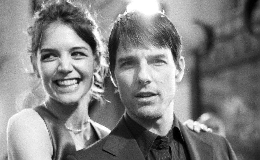 Katie Holmes and Tom Cruis pose for the press.