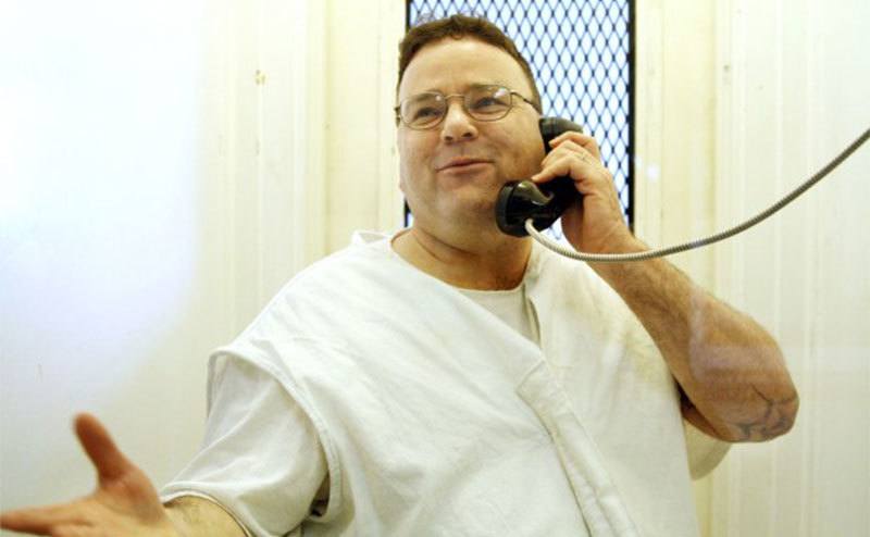 Tommy Lynn Sells talks on the telephone while in prison. 