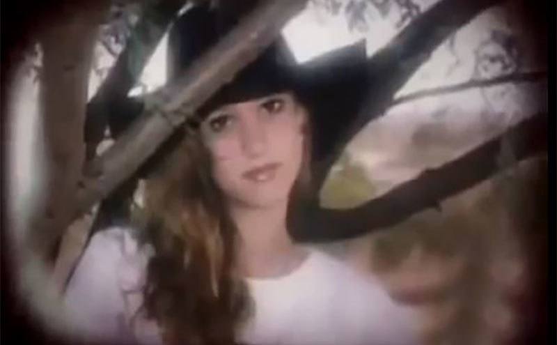 A photo of Katy Harris in her backyard. 