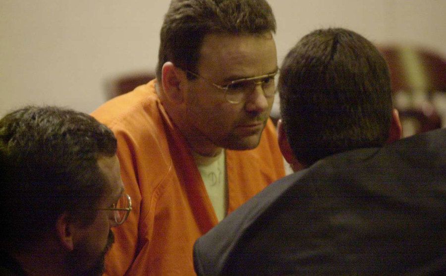 Sells confers with his lawyers in court. 