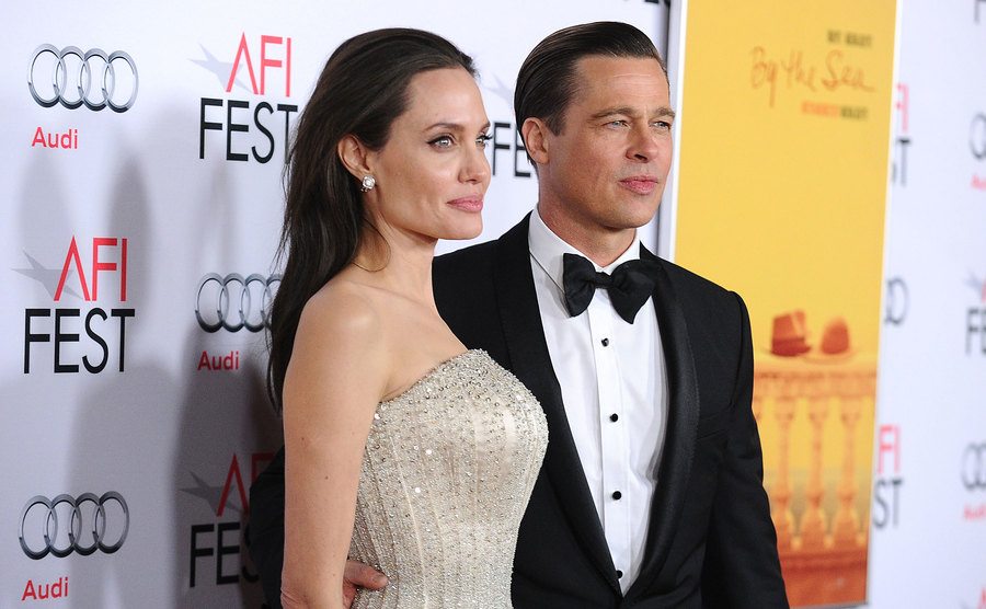 Angelina Jolie and Brad Pitt attend an event.
