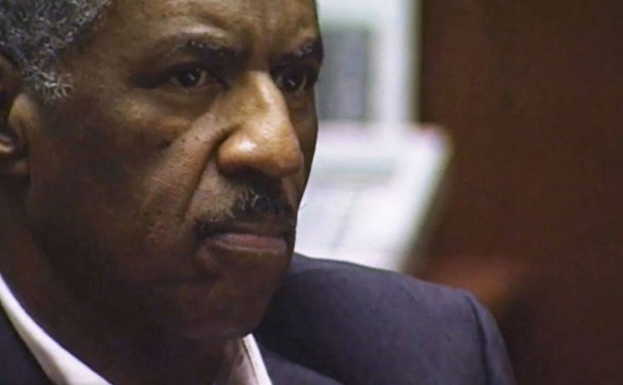 A still of Don in the courtroom.