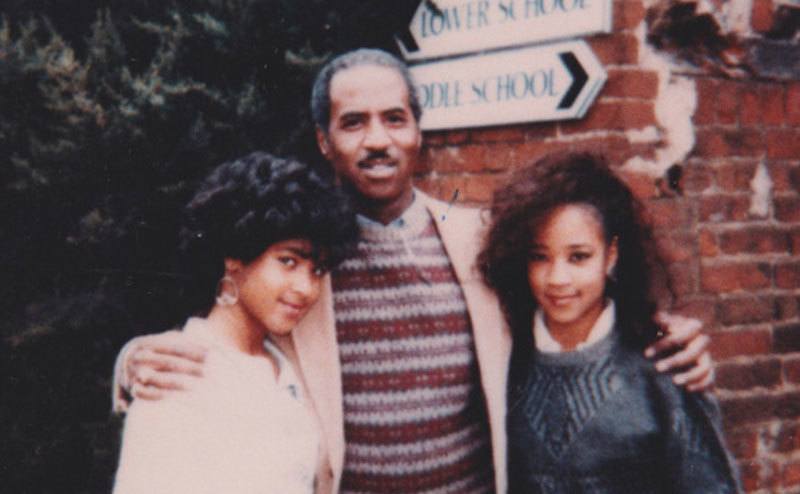 A portrait of Don and his two daughters.