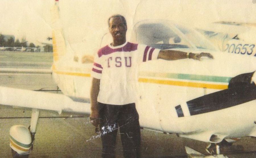 A portrait of Don standing next to his private jet.