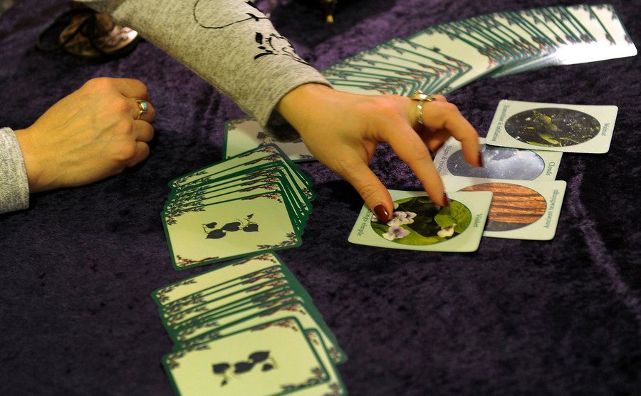 A psychic lays out some oracle cards.