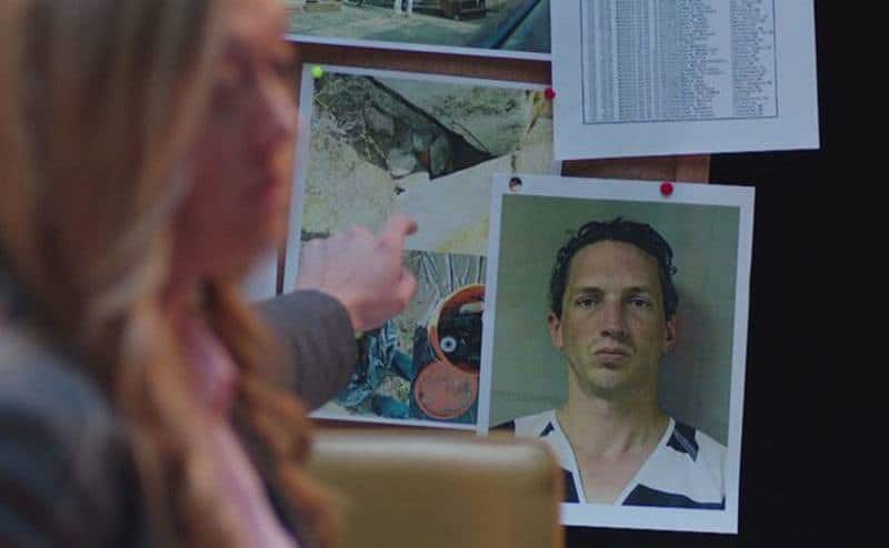 A photo of Keyes next to other photographed evidence.