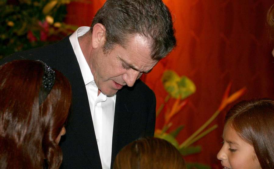 Mel Gibson is signing autographs.