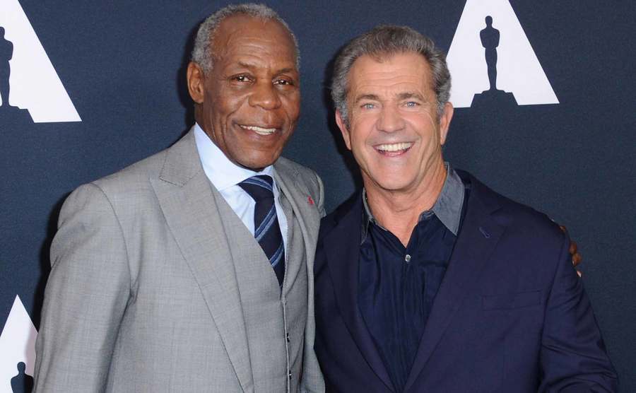 Danny Glover and Mel Gibson pose for the press.