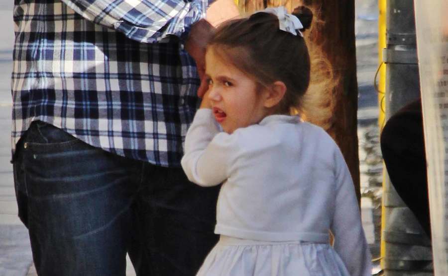 A picture of Lucia Gibson holding her father’s hand.