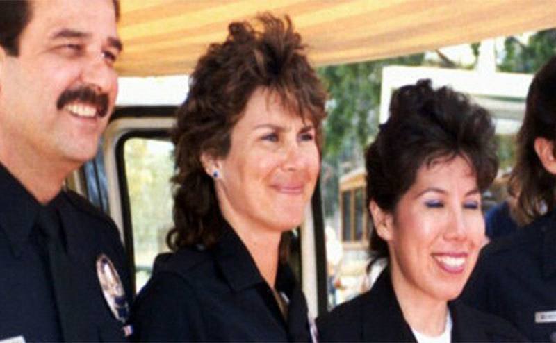 Stephanie poses with her fellow police officers