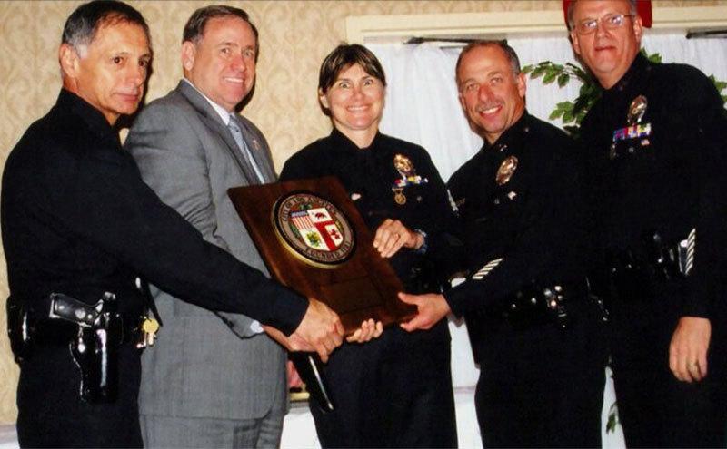 Stephanie poses with fellow officers during an event.