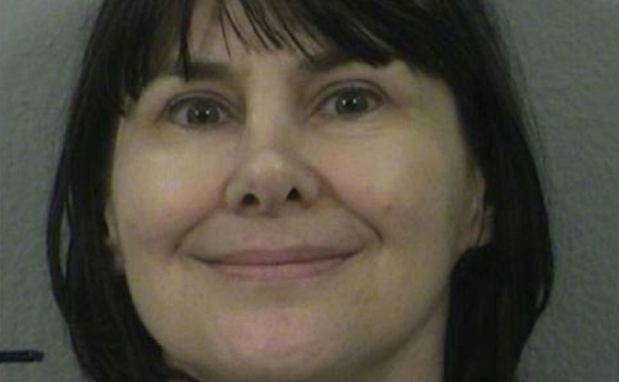Stephanie Lazarus flashes a creepy smile at the camera.