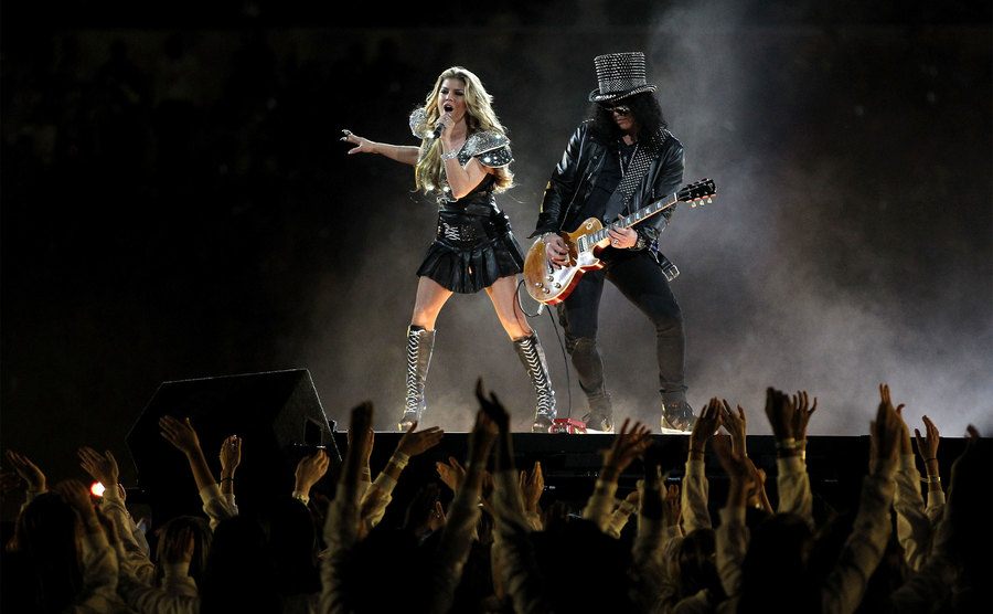 Fergie performs with Slash during the Bridgestone Super Bowl XLV Halftime Show.