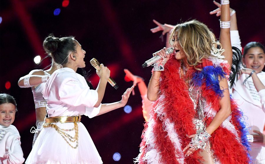 Emme Maribel Muñiz and Jennifer Lopez perform onstage during the Pepsi Super Bowl LIV Halftime Show.
