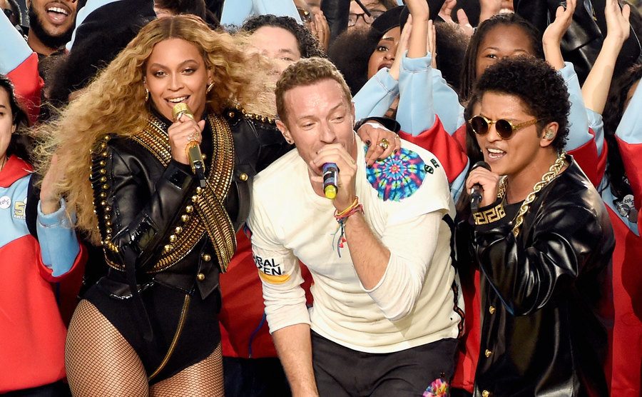 Beyonce, Chris Martin, and Bruno Mars perform onstage during the Super Bowl 50 Halftime Show.