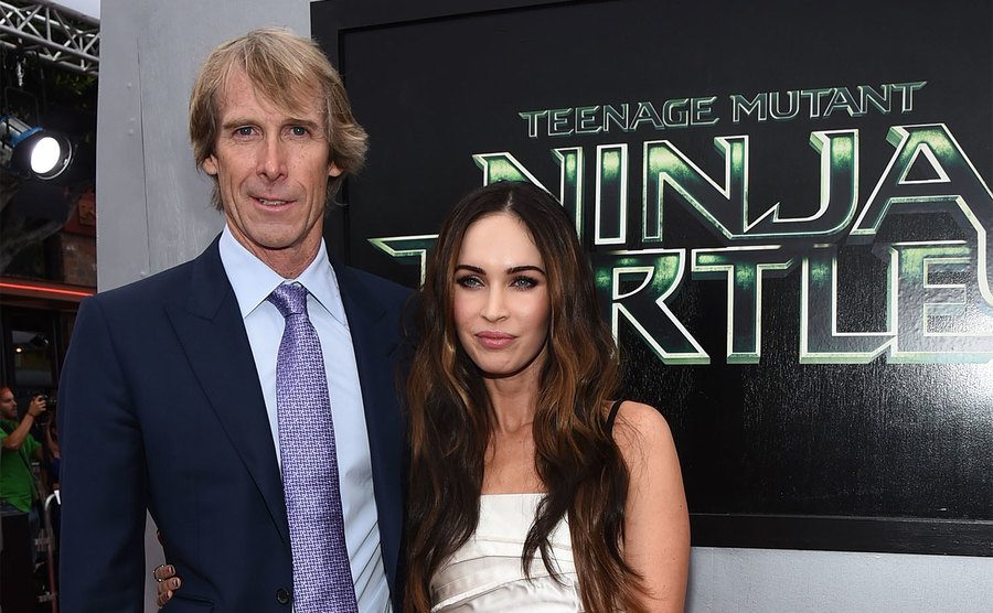 Michael Bay and Megan Fox attend the premiere of