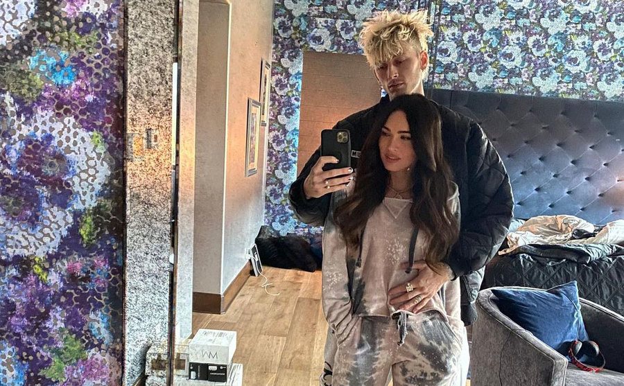 Fox and Kelly take a mirror selfie at home.