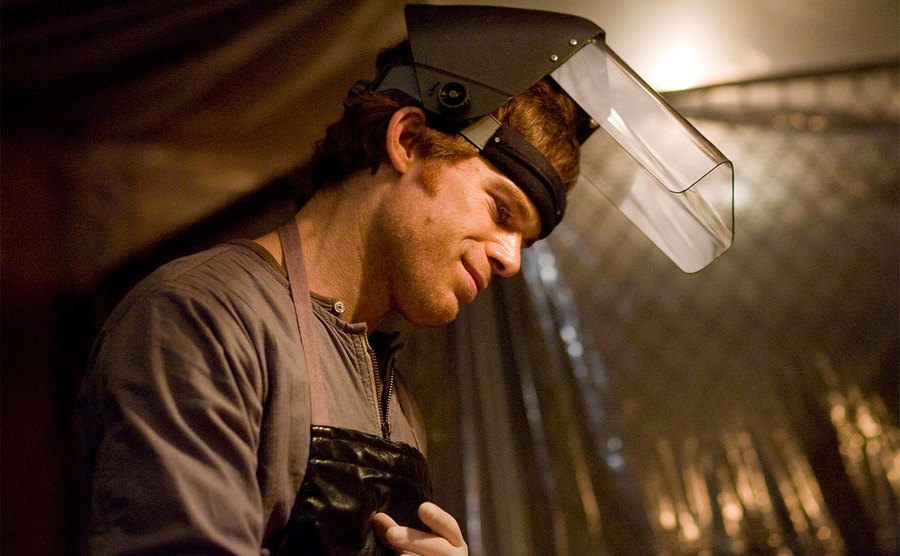 Michael C. Hall, as Dexter Morgan, stands in his murder room.