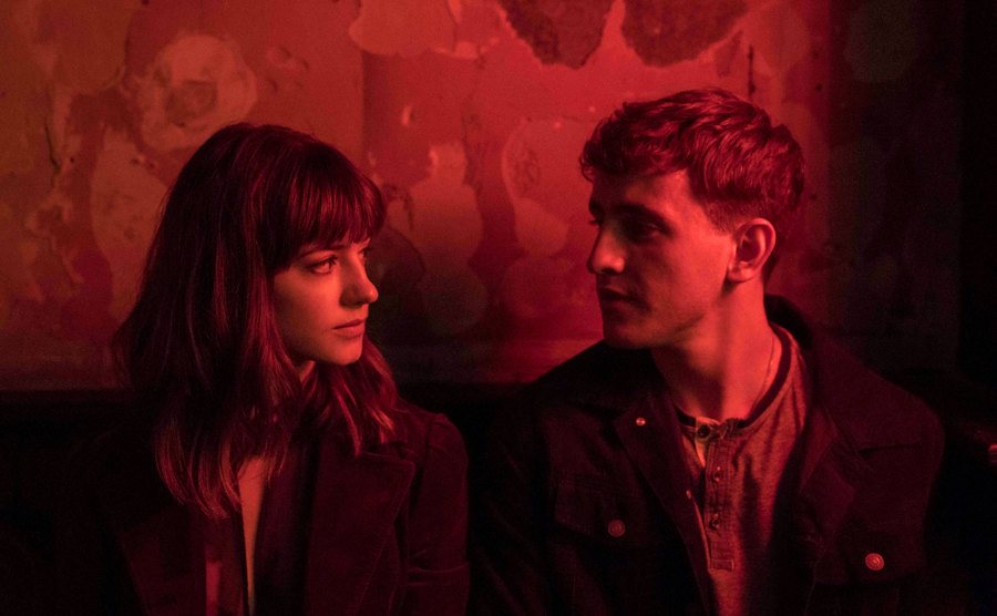 Daisy Edgar-Jones and Paul Mescal stare at each other intensely.